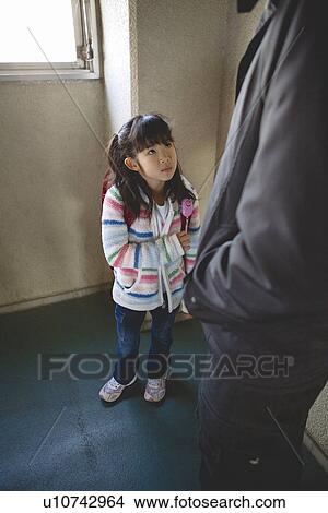 Picture - Girl standing in front of prowler. Fotosearch