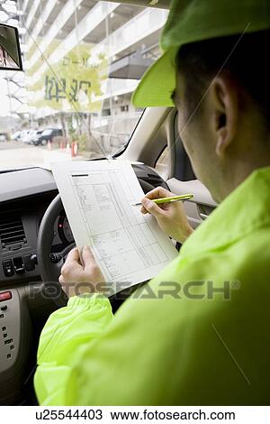 Stock Image - Man patrolling neighborhood. Fotosearch