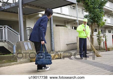Stock Photo - Teenage boy greeting super. Fotosearch