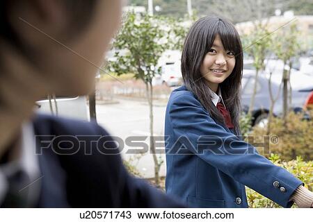 Stock Image - Teenage girl smiling. Fotosearch