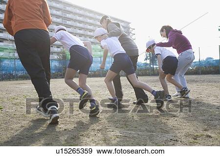 Stock Photo - Three families running foot race. Fotosearch