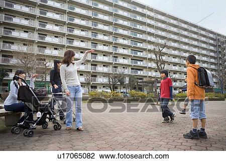Three mothers beckoning boys View Large Photo Image Stock Image - Three mothers beckoning boys. Fotosearch