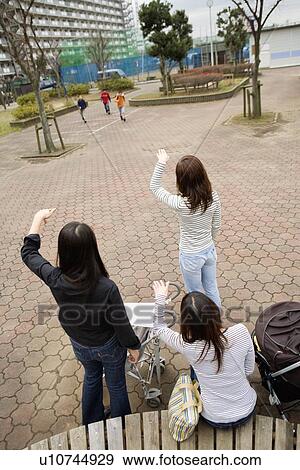 Three mothers beckoning boys View Large Photo Image Stock Photo - Three mothers beckoning boys. Fotosearch