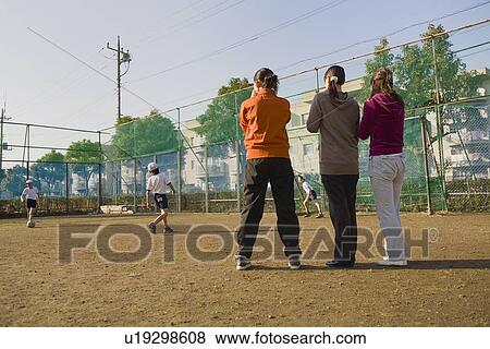 Three mothers cheering children View Large Photo Image Stock Photo - Three mothers cheering children. Fotosearch