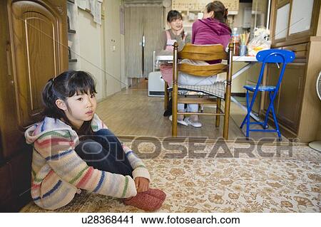 Two women chatting and one girl sitting View Large Photo Image Stock Image - Two women chatting and one girl sitting. Fotosearch