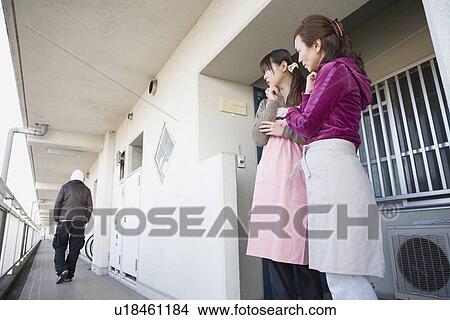 Picture - Two women watching prowler. Fotosearch