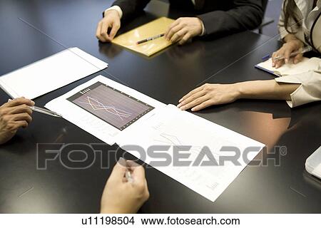 People's hands on meeting table View Large Photo Image Picture - People's hands on meeting table. Fotosearch