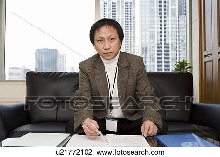 Portrait of mature man in office View Large Photo Image Stock Image - Portrait of mature man in office. Fotosearch