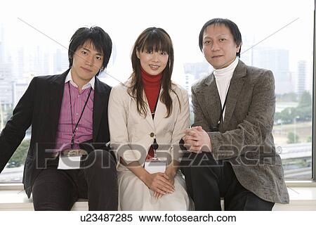 Stock Photography - Portrait of three people in office. Fotosearch