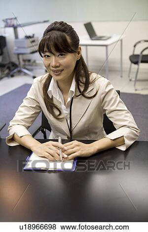 Stock Photo - Portrait of young woman. Fotosearch
