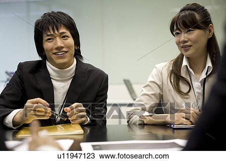 Two people meeting at table View Large Photo Image Stock Image - Two people meeting at table. Fotosearch