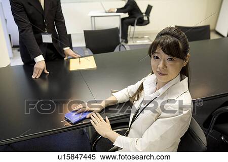 Stock Photography - Young businesswoman smiling. Fotosearch