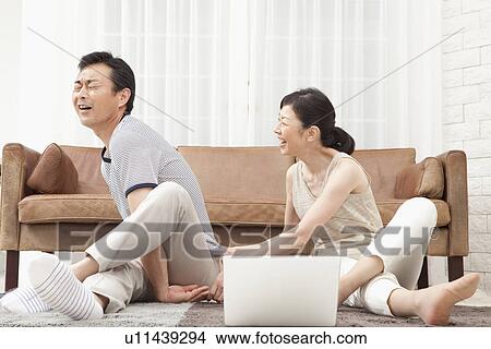 Mature couple stretching View Large Photo Image Picture - Mature couple stretching. Fotosearch