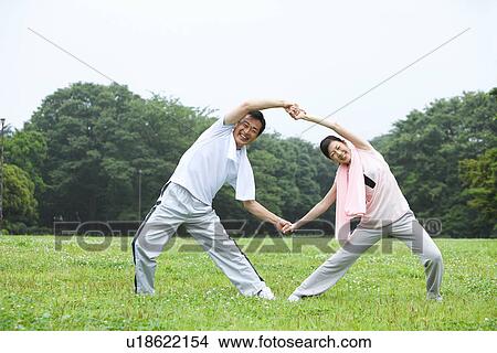Picture - Mature couple stretching. Fotosearch