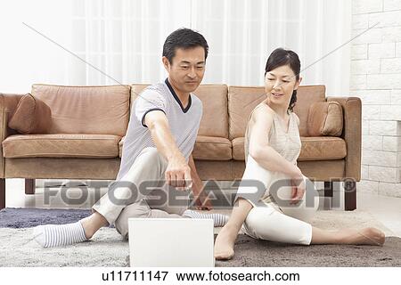 Mature couple stretching View Large Photo Image Stock Photo - Mature couple stretching. Fotosearch