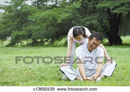 Mature couple stretching View Large Photo Image Stock Photo - Mature couple stretching. Fotosearch