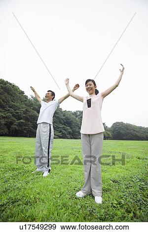 Mature couple stretching View Large Photo Image Stock Photo - Mature couple stretching. Fotosearch