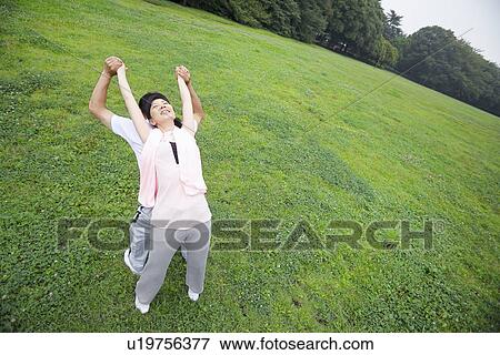 Stock Photo - Mature couple stretching. Fotosearch