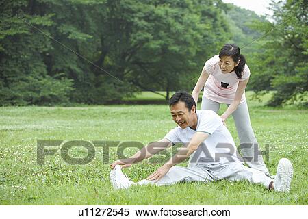 Stock Photography - Mature couple stretching. Fotosearch