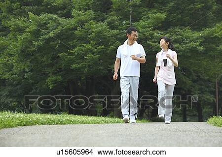 Picture - Mature couple walking. Fotosearch