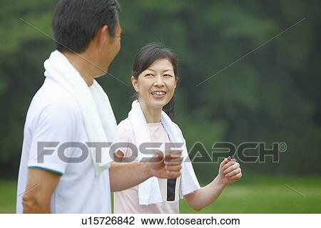 Stock Image - Mature couple walking. Fotosearch
