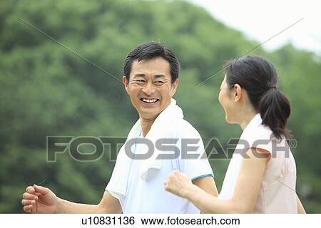 Stock Photograph - Mature couple walking. Fotosearch