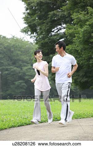 Stock Photograph - Mature couple walking. Fotosearch