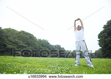 Mature man stretching View Large Photo Image Picture - Mature man stretching. Fotosearch