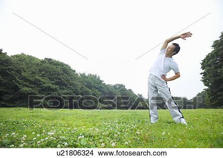 Picture - Mature man stretching. Fotosearch