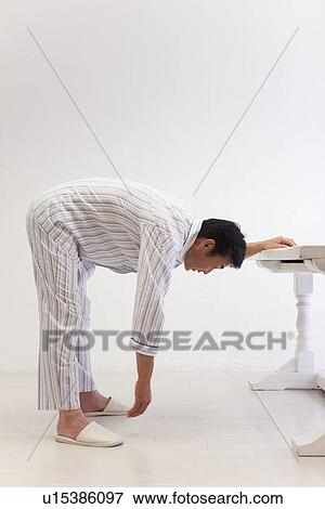 Mature man stretching shoulder View Large Photo Image Stock Photo - Mature man stretching shoulder. Fotosearch