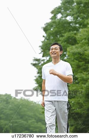 Mature man walking View Large Photo Image Stock Image - Mature man walking. Fotosearch