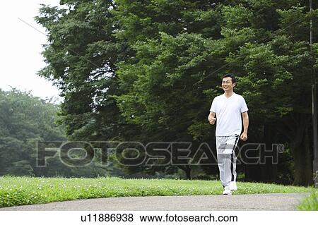 Mature man walking View Large Photo Image Stock Photo - Mature man walking. Fotosearch