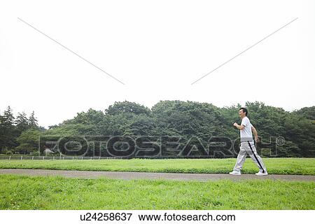 Mature man walking View Large Photo Image Stock Photo - Mature man walking. Fotosearch