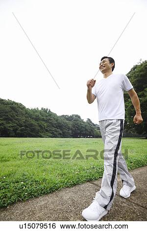 Stock Photograph - Mature man walking. Fotosearch
