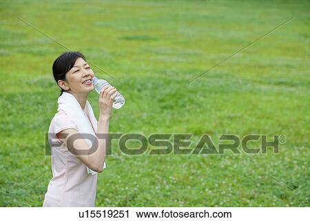 Mature woman drinking water View Large Photo Image Stock Image - Mature woman drinking water. Fotosearch