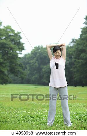 Mature woman stretching View Large Photo Image Stock Photo - Mature woman stretching. Fotosearch