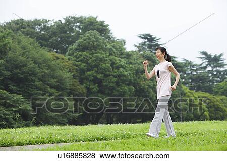 Stock Photo - Mature woman walking. Fotosearch