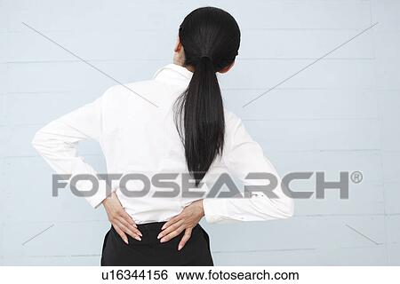Stock Photograph - Mid adult woman exhausted. Fotosearch