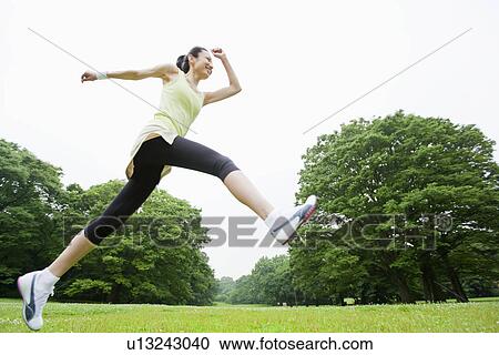 Mid adult woman stepping View Large Photo Image Stock Image - Mid adult woman stepping. Fotosearch