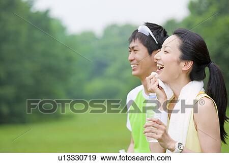 Stock Photo - Profile of young man and mid adult woman. Fotosearch