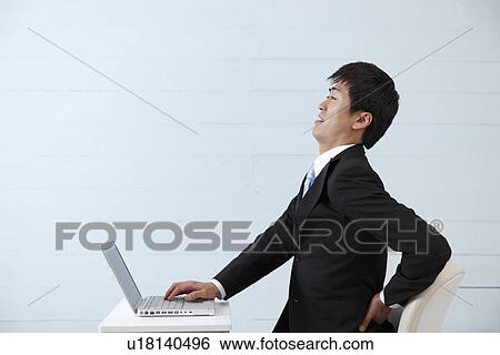Stock Photograph - Young businessman exhausted. Fotosearch