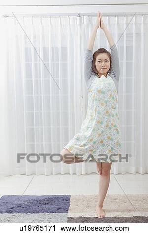 Young woman stretching View Large Photo Image Stock Image - Young woman stretching. Fotosearch