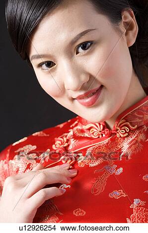 Close-up of young woman in Cheongsam, portrait View Large Photo Image Picture - Close-up of young woman in Cheongsam, portrait. Fotosearch