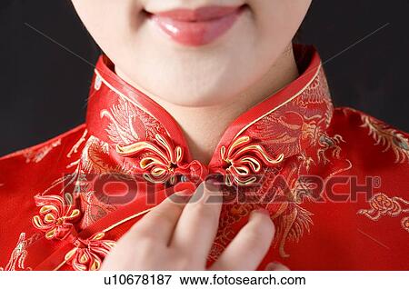 Stock Photo - Close-up of young woman in Cheongsam. Fotosearch