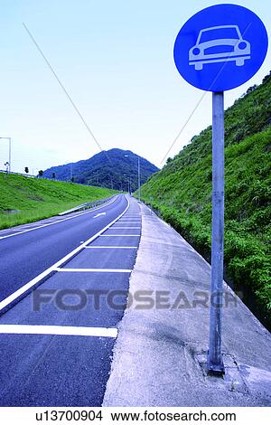 Picture - the mountain range, going, traffic, light, the highway, the road. Fotosearch