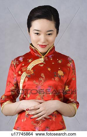 Young woman in cheongsam View Large Photo Image Picture - Young woman in cheongsam. Fotosearch