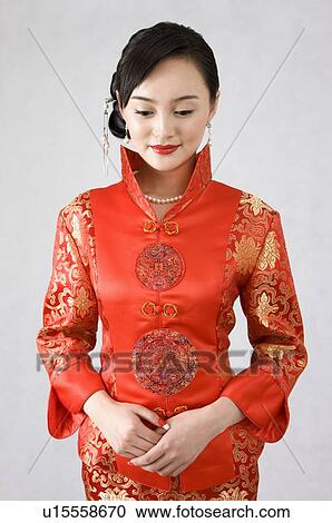 Young woman in cheongsam View Large Photo Image Stock Image - Young woman in cheongsam. Fotosearch