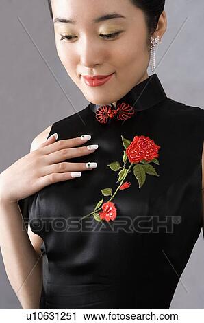 Young woman with black cheongsam View Large Photo Image Stock Image - Young woman with black cheongsam. Fotosearch