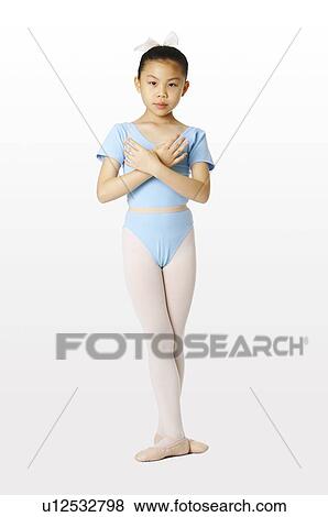 Girl alternating her hands before her chest View Large Photo Image Stock Photo - Girl alternating her hands before her chest. Fotosearch