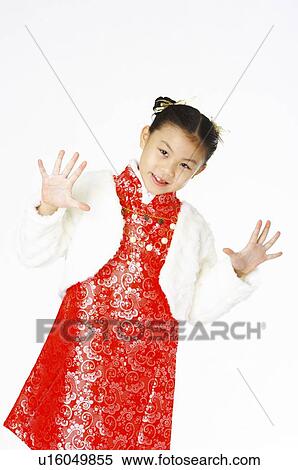 Stock Photography - Girl in chinese traditional dress extend her fingers. Fotosearch